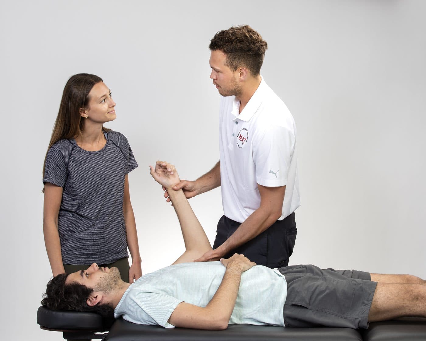 Cameron Hunt guiding spinal and torso movement during a MAT session